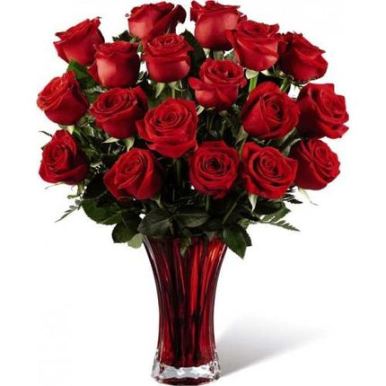 Bouquet of red roses in a red vase